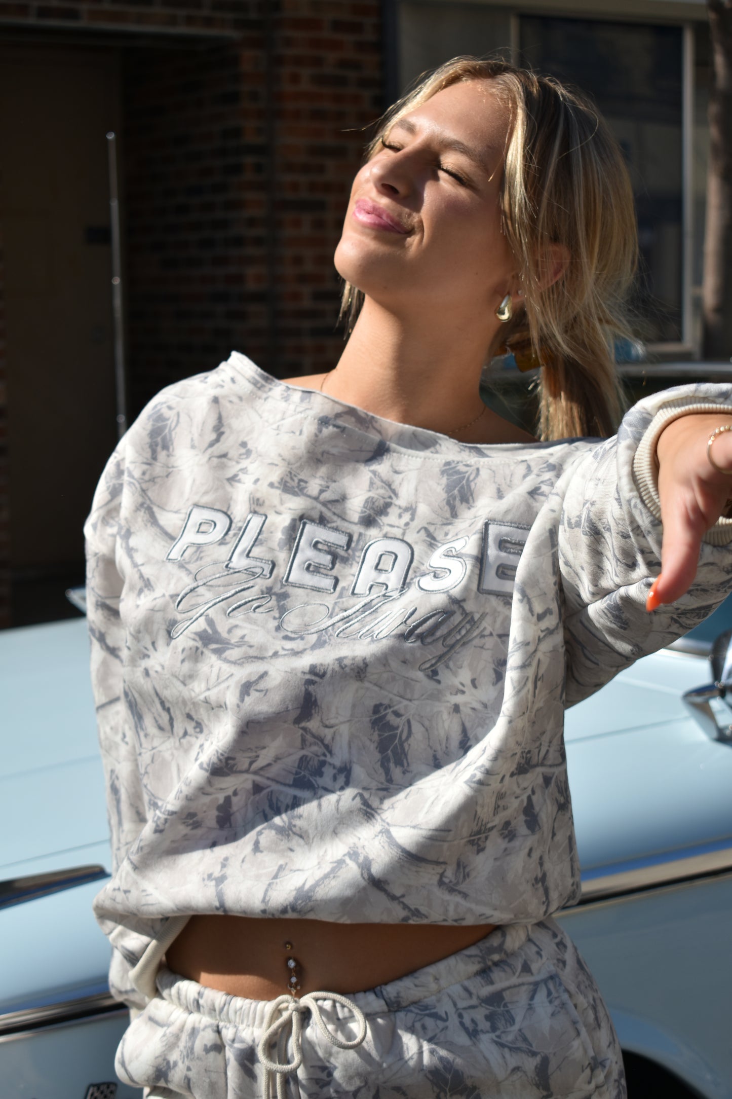 Off the shoulder "Please go away".
